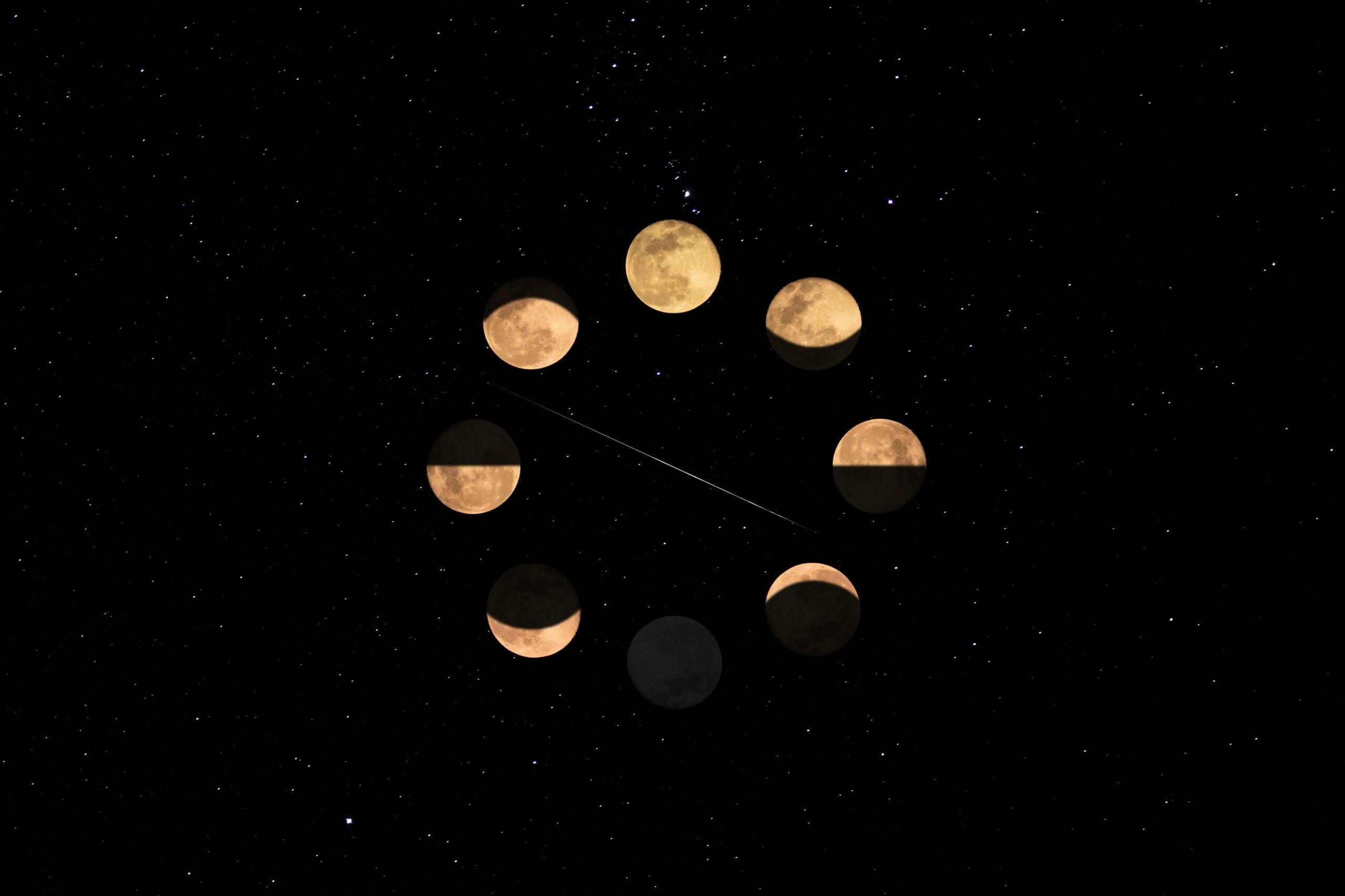 Illustration of the moon phases against a star-filled night sky, highlighting lunar cycle.